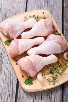 Raw chicken legs with spices