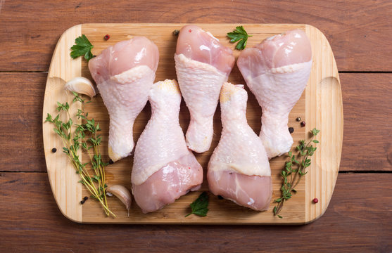 Raw chicken legs with spices