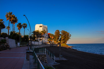 Fototapeta premium Promenade. The promenade of Estepona in front of the sunset. Malaga province, Andalusia, Spain. Picture taken – 4 may 2018.