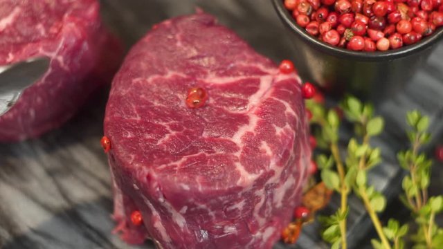 an appetizing piece of meat sprinkled with salt and pepper