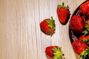 appetizing ripe strawberries on a plate, top view, vitamin Breakfast