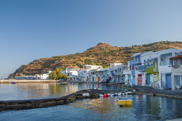Fototapeta na wymiar Syrmata colorful fishermans houses of Klima village at Milos island in Greece