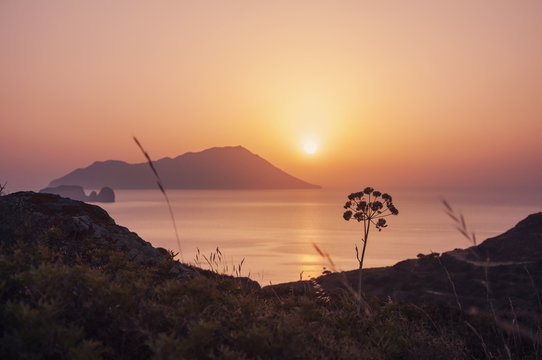 Romantic sunset at Milos island in Greece