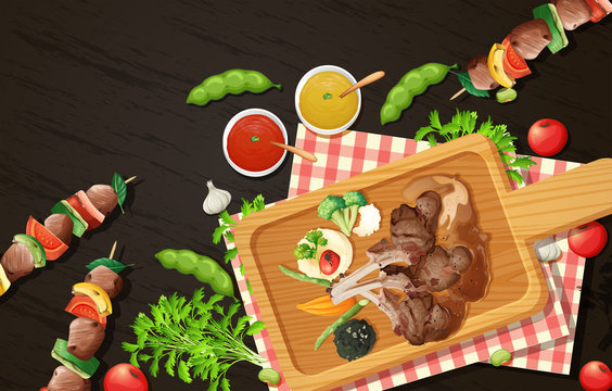 Grilled Lamb Chops and Barbecue on Wooden Board