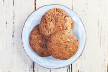 Handmade chocolate cookies on wooden table
