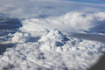 Fluffy white clouds view from plane
