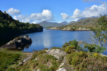 Lake among rock formations in Reeks mountain range in Kerry in Ireland.