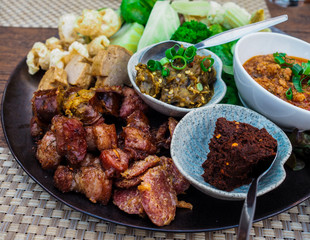 Thai food - Northern style dips with northern thai spicy sausage (sai oua), fried pork skin and Vetgetable Set