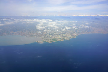 Aerial view of the Nice area, the Baie des Anges and the French Riviera on the Mediterranean Sea with the Nice Cote d'Azur Airport (NCE) in the foreground