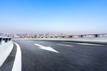 Fototapeta premium empty aspalt road with modern office building