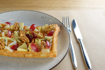 Belgian waffle with grapes, walnut and cheese