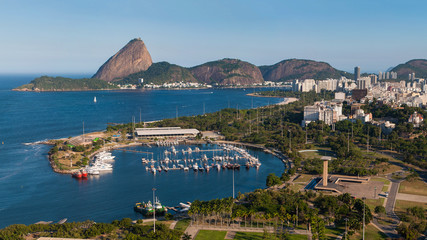 View of Marina da Gloria With Ships and Yachts in Guanabara Bay, and the Sugarloaf Mountain in the Horizon, in Rio de Janeiro, Brazil - obrazy, fototapety, plakaty