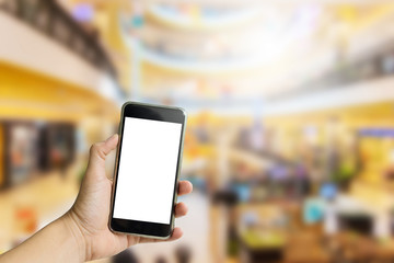 Hand hold on mobile with department store background