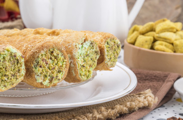 Sweet Bakery Food Puff Roll with Cream Also Know As Homemade Cream Roll, Puff Pastry, Swiss And Jelly Roll is a type of sponge cake roll filled with whipped cream, jam