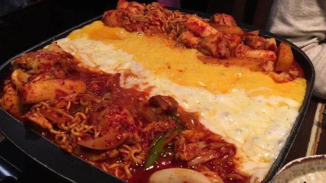 KOREAN FOOD : CHEESE DAK GALBI at the restaurant.
