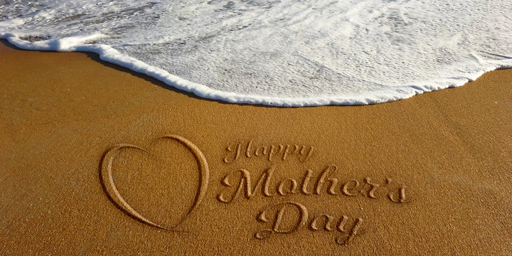 Mother's Day Heart Sign in Sand Beach. Photo Image