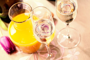 Two flute glasses filled with champagne