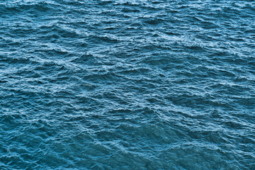 Obraz premium Water background texture. Sea surface in sunset light