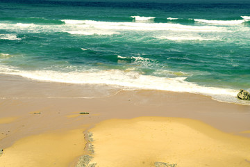 Fototapeta na wymiar Soft wave of blue ocean on white sand beach , Seascape background