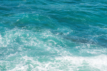 Sea water splash with foamy wave. Water surface texture.
