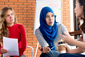 Diverse women in group meeting