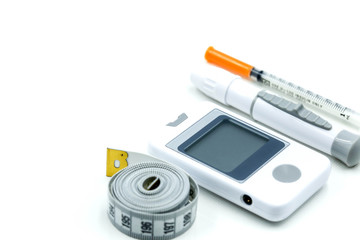 Fototapeta premium Glucose meter diabetes test and Syringe with measuring tape,concept of diabetes, healthy lifestyles and nutrition