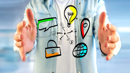Businessman holding a Hand drawn icon of business, multimedia and technology - Start up concept
