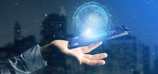 Man holding a 3d rendering data earth globe on a smartphone