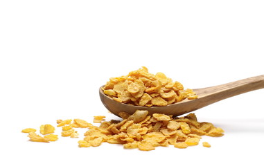 Crunchy corn flakes, cereal, muesli pile in wooden spoon  isolated on white background