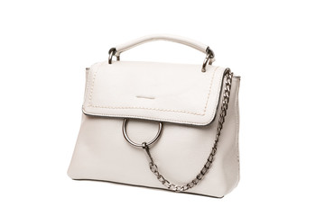 white female bag with decorative chain on white background