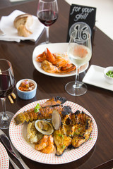 Various seafood dishes served on the table, view from above