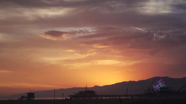 LOS ANGELES, CALIFORNIA - June 2017: Beautiful sunset with dramatic colors on Venice, a view of the Santa Monica Pier. 