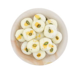 Indian sweet peda also called pedha, pera or peday is a prepared in thick, semi-soft pieces. the main ingredients are khoya, sugar and flavorings, including cardamom seeds, pistachio nuts and saffron