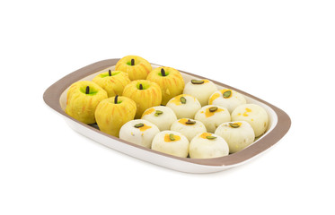 Indian Mix Sweet Food Apple Shaped Peda With White Peda Also Know as pedha, pera or peday is a prepared in thick, semi-soft pieces. the main ingredients are khoya, sugar and flavorings
