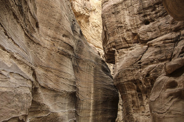Sandstone gorge Siq,Rose City, Petra, Jordan. Red canyon walls create many abstracts