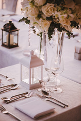 Table setting at a luxury wedding and Beautiful flowers on the table.