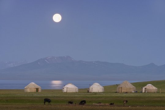 Moon rising over Song Kol lake and nomads Yurts, Naryn province, Kyrgyzstan, Asia