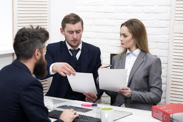 Business partners, businessmen at meeting, office background. Business negotiations concept. Business negotiations, discuss conditions of deal, contract. Woman lawyer explain terms of transaction.