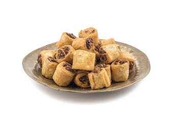 Indian Fried Bhakarwadi Tea Time Snack also known as bakarwadi, bakarvadi, bakar vadi, bakar wadi or spring roll is a traditional spicy Maharashtra and Gujarat Snack isolated on White Background