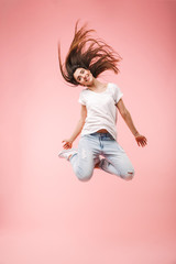 Full length of an excited young woman with long hair