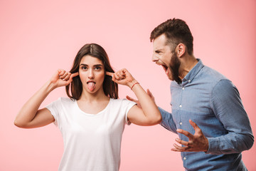 Portrait of an angry young couple having an argument - obrazy, fototapety, plakaty