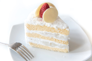 Coconut cake Topping Strawberry on white plate.