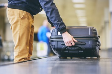 Fototapeta na wymiar Suitcase on baggage claim