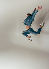 shot of mad, crazy, cheerful, successful, lucky guy in casual outfit, jeans, jumping with hands up,triumphant, gesturing against white background