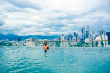Relaxing in Kuala lumpur infinity pool