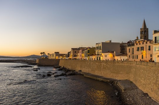 Waterfront in the coastal town of Alghero after sunset, Sardinia, Italy, Europe