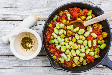 Fried ingredients for the preparation of shakshouka with seasonal vegetables.
