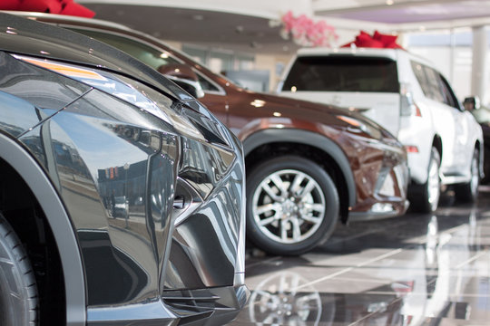 Car auto dealership.Themed blur background with bokeh effect. New cars at dealer showroom.