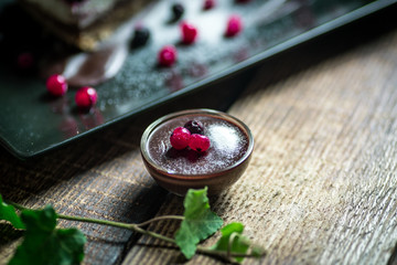 Obraz na płótnie Canvas Homemade cheesecake with fresh berries and chocolate