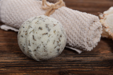 lonely relaxation ball for bath white clean towel on a brown background